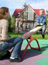 Mother with child on seesaw