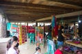 mother and child are selling traditional clothes of the Dayak Tunjung tribe