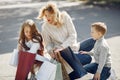 Mother with child with shopping bag in a city Royalty Free Stock Photo
