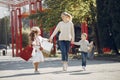 Mother with child with shopping bag in a city Royalty Free Stock Photo