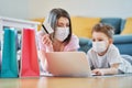 Mother and child shopping online during coronavirus pandemic Royalty Free Stock Photo