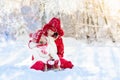 Mother and child sledding. Winter snow fun. Family on sleigh. Royalty Free Stock Photo