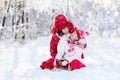 Mother and child sledding. Winter snow fun. Family on sleigh. Royalty Free Stock Photo