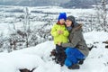 Mother and child on snowy winter walk. Family enjoying beautiful winter nature. Snowy winter season Royalty Free Stock Photo