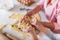 Mother and child son boy are cooking cookies and having fun in the kitchen. Homemade food and little helper Royalty Free Stock Photo