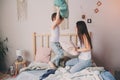 Mother and child son enjoying weekend morning in bed, casual lifestyle