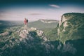 Mother with child standing on rocky top. Instagram stylization Royalty Free Stock Photo