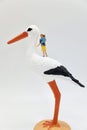 mom with child and a stork miniature figurines