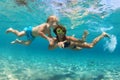 Mother with child swim underwater with fun in sea Royalty Free Stock Photo