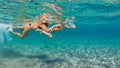 Mother with child swim underwater with fun in sea Royalty Free Stock Photo