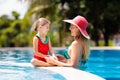 Mother, child at swimming pool. Mom and kid swim Royalty Free Stock Photo