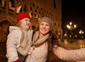 Mother with child taking selfie on Piazza San Marco in Venice Royalty Free Stock Photo