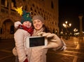 Mother and child taking selfie on Piazza San Marco in Venice Royalty Free Stock Photo