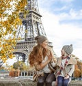 Mother and child travelers playing on embankment in Paris Royalty Free Stock Photo