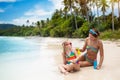 Mother and child on tropical beach