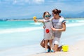 Mother and child on tropical beach. Sea vacation Royalty Free Stock Photo