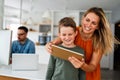 Mother and child using digital tablet for e-learning. Education home digital device kid concept. Royalty Free Stock Photo