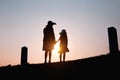 Mother and child are walking together in fun in love at sunset Royalty Free Stock Photo