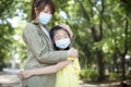 Mother and child wear face mask during coronavirus and flu