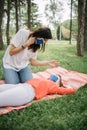 Mother and child wearing masks in park during coronavirus