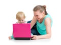Mother and child working at laptop