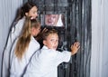 Mother with childred are helping dad and girl get out of the locked door Royalty Free Stock Photo