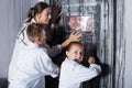 Mother with childred are helping dad and girl get out of the locked door Royalty Free Stock Photo