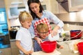 Mother and children baking together Royalty Free Stock Photo