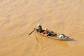 Mother with children in the boat from Tonle Sap Lake, Cambodia