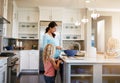 Mother, children and cookies in kitchen for baking with learning, bonding and preparation in home with sunlight. Family Royalty Free Stock Photo