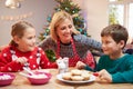 Mother And Children Decorating Christmas Cookies Together Royalty Free Stock Photo