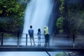 Mother and children enjoy Situ Gunung waterfall view Royalty Free Stock Photo