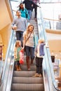 Mother And Children On Escalator In Shopping Mall Royalty Free Stock Photo