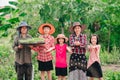 Mother and children family holding seeding plants to planting tree on blurred green nature background Royalty Free Stock Photo