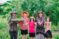 Mother and children family holding seeding plants to planting tree on blurred green nature background Royalty Free Stock Photo