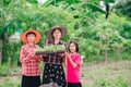 Mother and children family holding seeding plants to planting tree on blurred green nature background Royalty Free Stock Photo