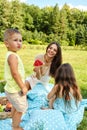 Mother With Children Having Fun In Park. Happy Family Outdoors Royalty Free Stock Photo