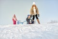 Mother and children having fun on snow Royalty Free Stock Photo