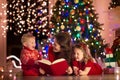 Mother and children at home on Christmas eve Royalty Free Stock Photo