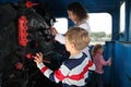 Mother with children in locomotive cabin