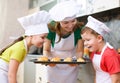 Mother with children making bread Royalty Free Stock Photo