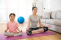 Mother with children meditating doing yoga Royalty Free Stock Photo