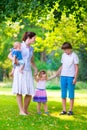 Mother and children playing in a park Royalty Free Stock Photo