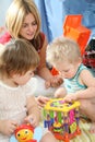 Mother and children in playroom