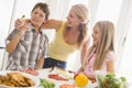 Mother And Children Prepare A meal