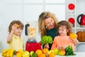 Mother and children are preparing the vegetables and fruit. Happy loving family. Healthy smoothie. Spinach smoothie Royalty Free Stock Photo