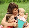 Mother and children reading a book i Royalty Free Stock Photo