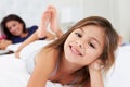 Mother And Children Relaxing In Bed Wearing Pajamas Royalty Free Stock Photo