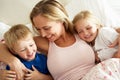 Mother And Children Relaxing Together In Bed Royalty Free Stock Photo