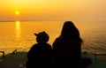 Mother and children silhouette in the sunset Royalty Free Stock Photo